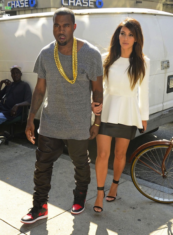 Kanye wears Robert Geller Grey T-shirt, Jordan Retro and Kim Kardashian wears Celine Top & Sandals | Modern